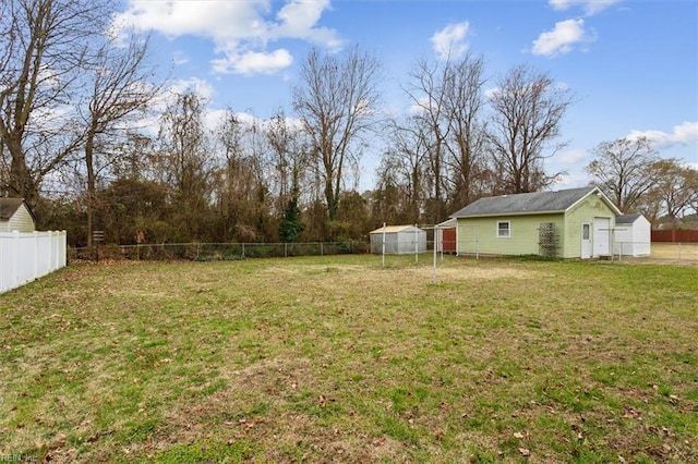 view of yard featuring an outbuilding and a fenced backyard