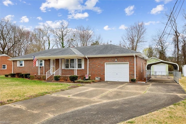 ranch-style house featuring a front lawn, a detached carport, concrete driveway, a garage, and brick siding