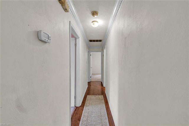 corridor with visible vents and wood finished floors