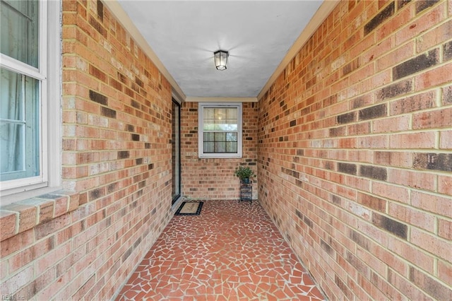 hallway with brick wall