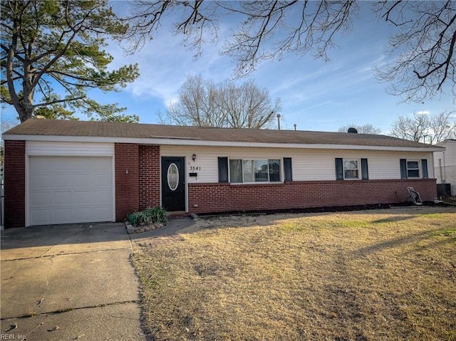 single story home featuring a garage, driveway, and brick siding