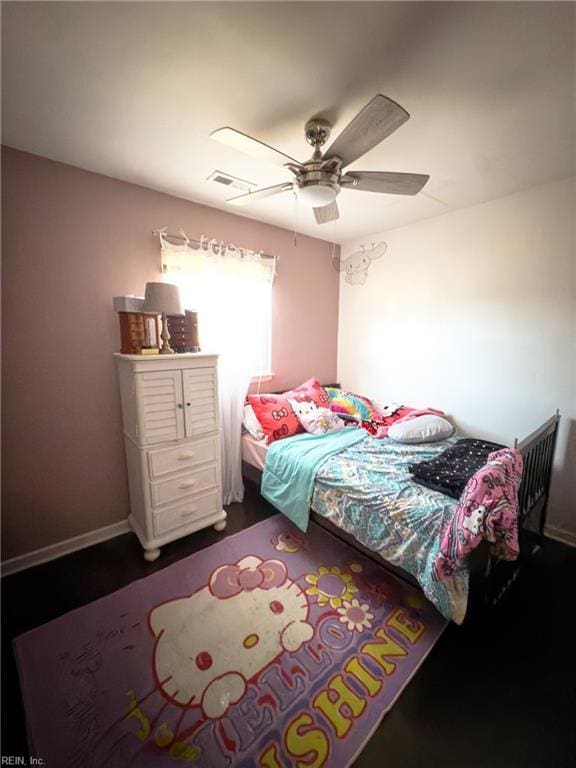 bedroom featuring a ceiling fan and baseboards