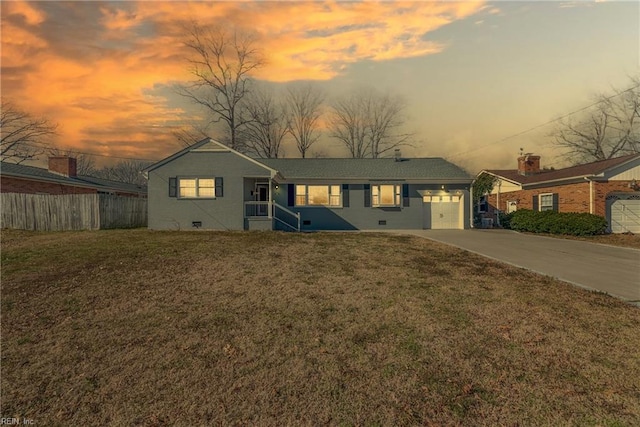 ranch-style house featuring a garage, concrete driveway, crawl space, fence, and a front lawn