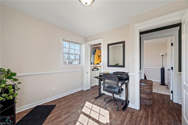 office featuring baseboards and wood finished floors