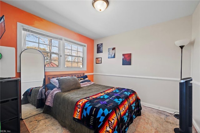 bedroom featuring baseboards