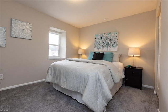 bedroom with baseboards and light colored carpet