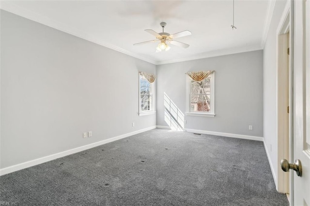 carpeted empty room with a ceiling fan, ornamental molding, and baseboards