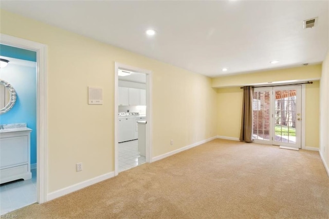 spare room with recessed lighting, visible vents, baseboards, and light colored carpet