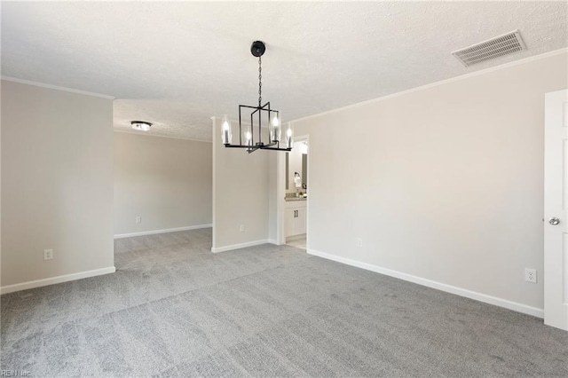 spare room with ornamental molding, visible vents, and carpet floors