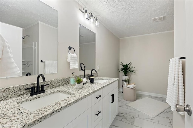 full bath with a shower, marble finish floor, a sink, and baseboards