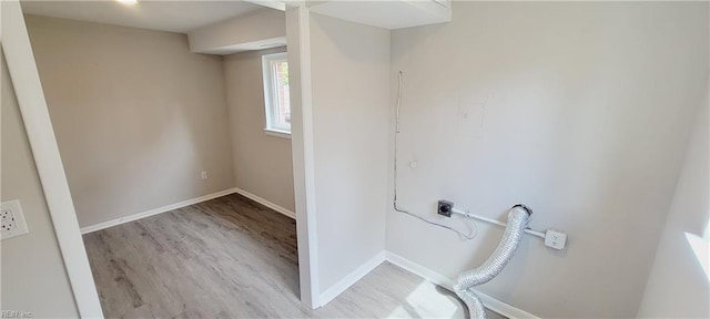 washroom with laundry area, wood finished floors, electric dryer hookup, and baseboards