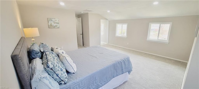 bedroom featuring recessed lighting, baseboards, vaulted ceiling, and light colored carpet