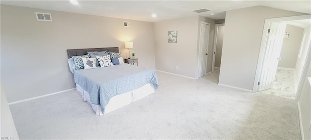 carpeted bedroom featuring baseboards and visible vents