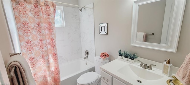 bathroom with shower / bathtub combination with curtain, vanity, and toilet