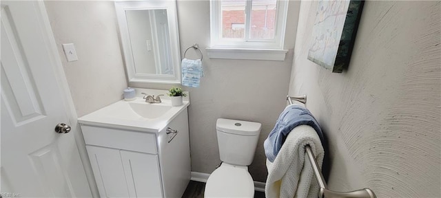 half bath with toilet and vanity