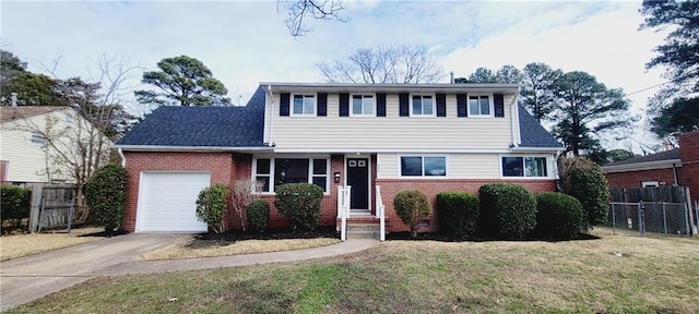 view of front of house with a garage, a front yard, fence, and brick siding