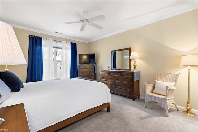 carpeted bedroom featuring visible vents, crown molding, baseboards, and ceiling fan