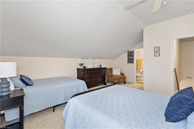 carpeted bedroom featuring lofted ceiling, ceiling fan, and connected bathroom