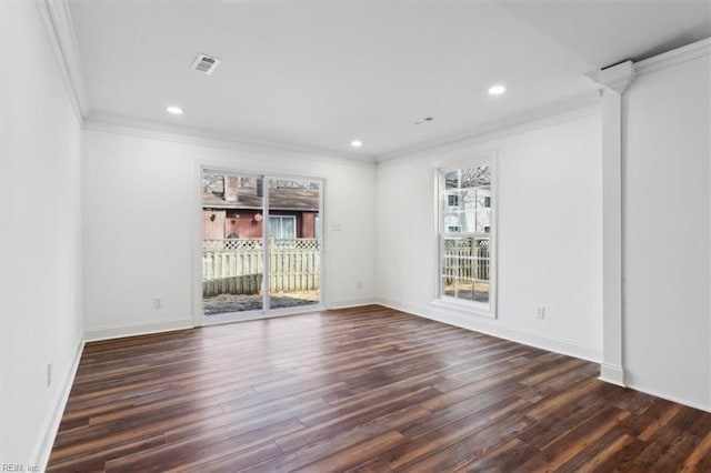 unfurnished room with crown molding, recessed lighting, dark wood finished floors, and baseboards