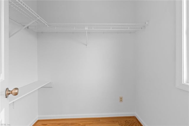 spacious closet featuring light wood-type flooring