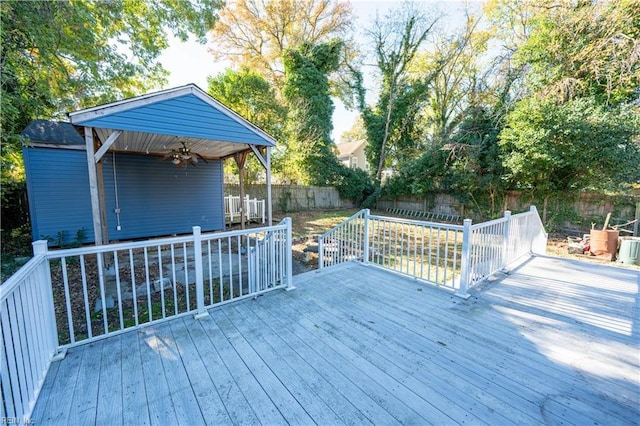 deck featuring a fenced backyard and ceiling fan