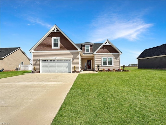 craftsman inspired home with a garage, concrete driveway, and a front lawn