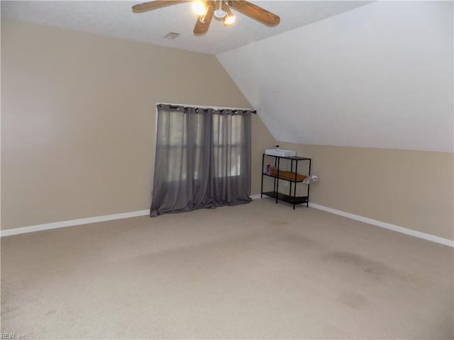 bonus room featuring a ceiling fan, carpet, vaulted ceiling, and baseboards