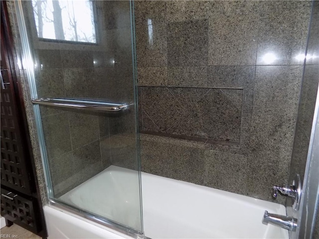 full bathroom with shower / bath combination with glass door