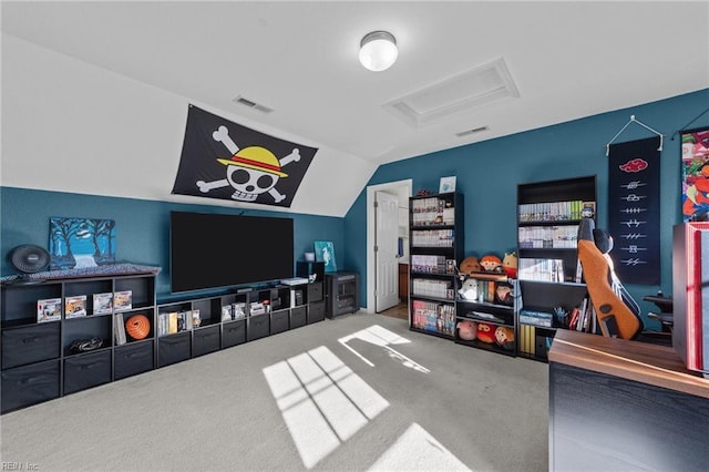 living area with lofted ceiling, attic access, visible vents, and carpet flooring