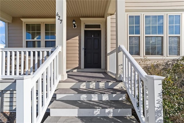 entrance to property featuring covered porch