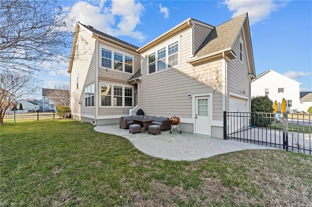 back of house featuring a garage, driveway, a lawn, fence, and a patio area