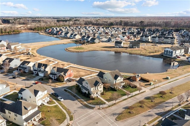 birds eye view of property with a residential view and a water view