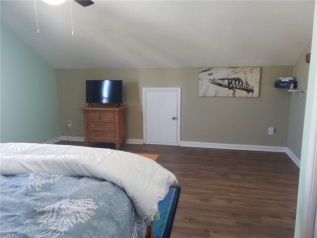 bedroom with ceiling fan, baseboards, vaulted ceiling, and wood finished floors