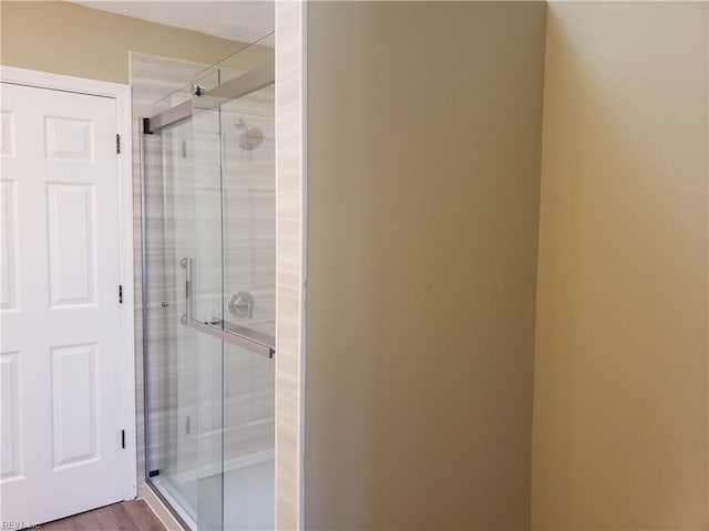 bathroom featuring a shower stall