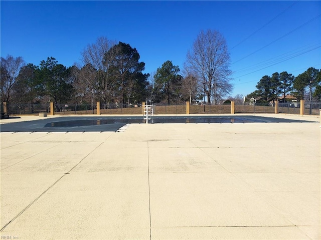 surrounding community featuring a patio area, a swimming pool, and fence