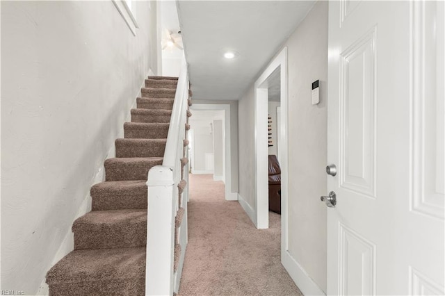 staircase with carpet and baseboards