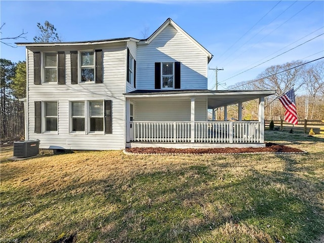 view of front facade featuring a front lawn, a porch, and central air condition unit