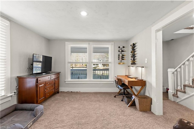 office space featuring carpet flooring and a textured ceiling