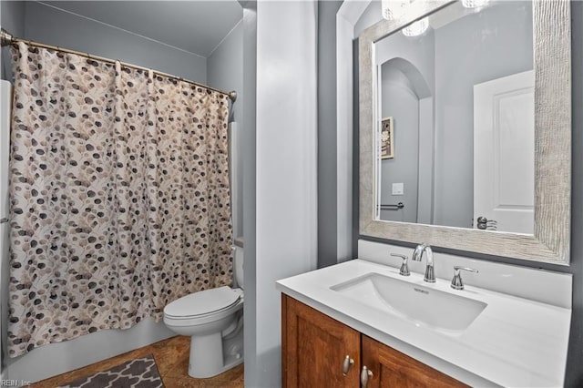 bathroom with shower / bath combination with curtain, vanity, and toilet