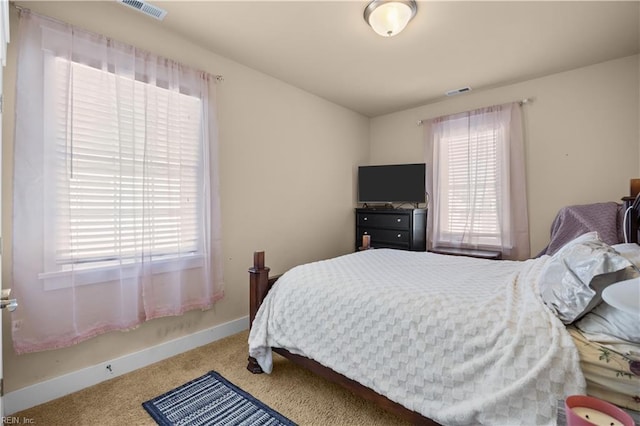 bedroom with carpet, baseboards, and visible vents