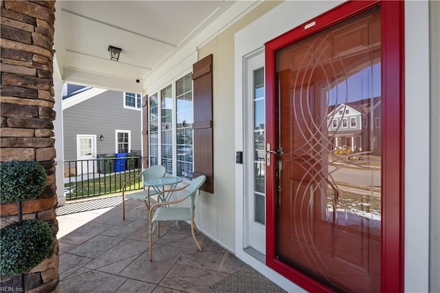 doorway to property with covered porch