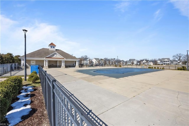 pool featuring a residential view, fence, and a patio