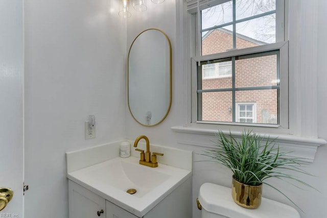 bathroom with toilet and vanity