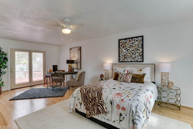 bedroom with wood finished floors, a ceiling fan, and access to exterior