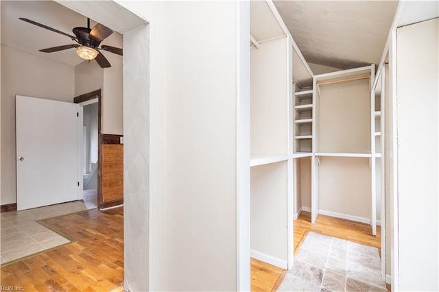 spacious closet featuring wood finished floors and a ceiling fan