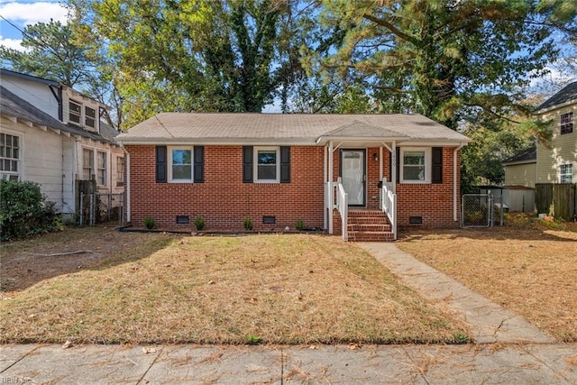 bungalow-style house featuring crawl space, brick siding, fence, and a gate