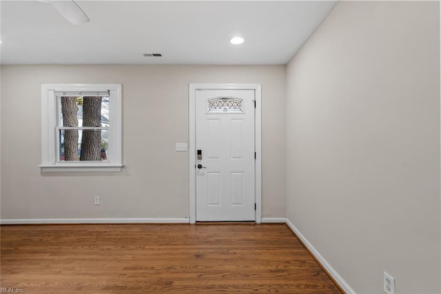 foyer entrance featuring recessed lighting, wood finished floors, visible vents, and baseboards