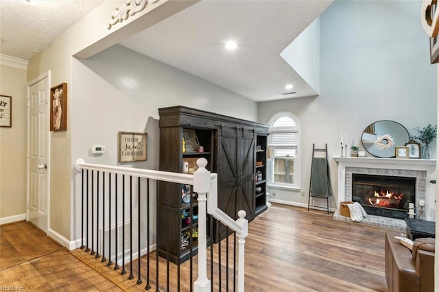 interior space featuring baseboards, wood finished floors, and recessed lighting