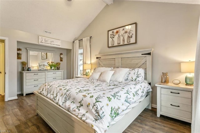 bedroom with dark wood finished floors, visible vents, vaulted ceiling with beams, and baseboards