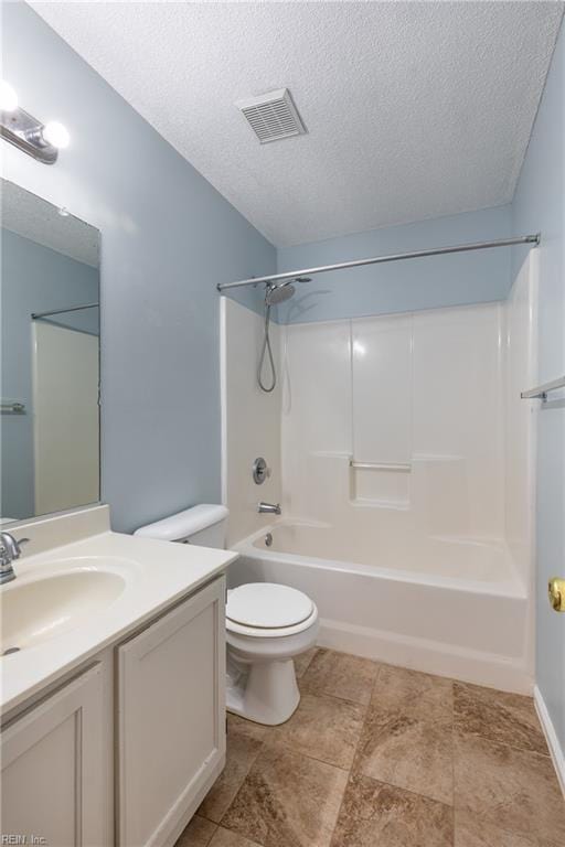 full bathroom featuring visible vents, toilet,  shower combination, a textured ceiling, and vanity